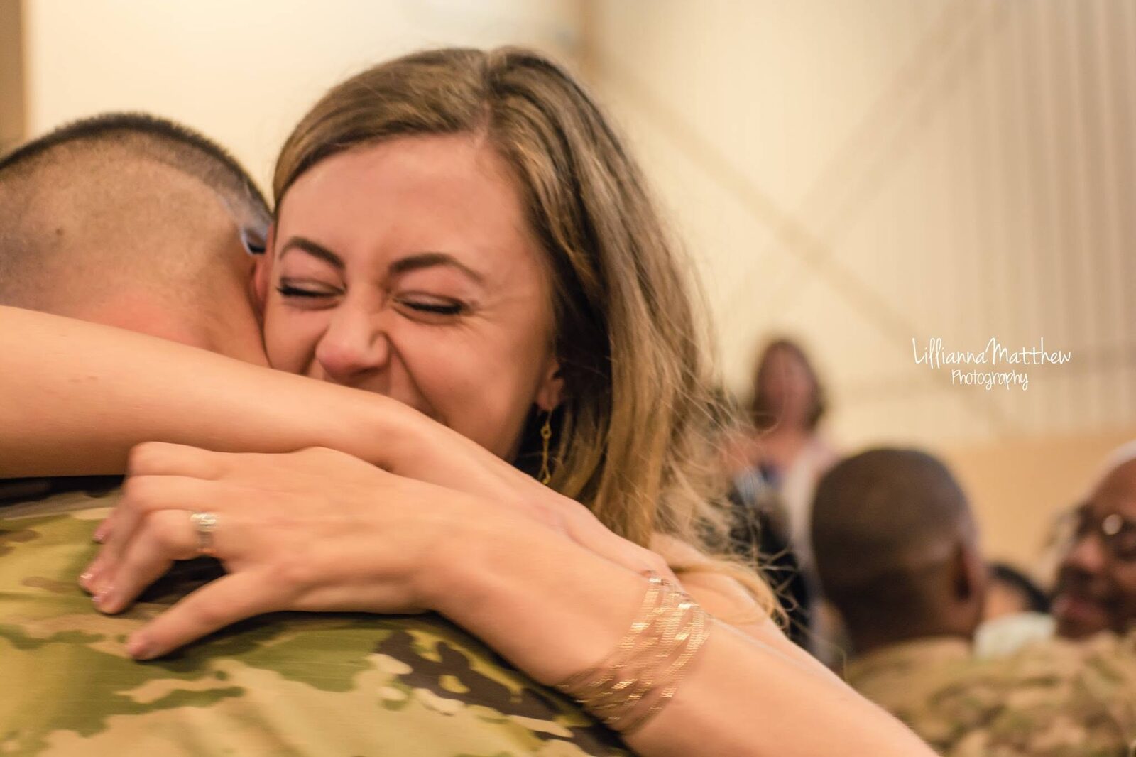 Emotional close-up embrace, wife's eyes closed in joy and relief
