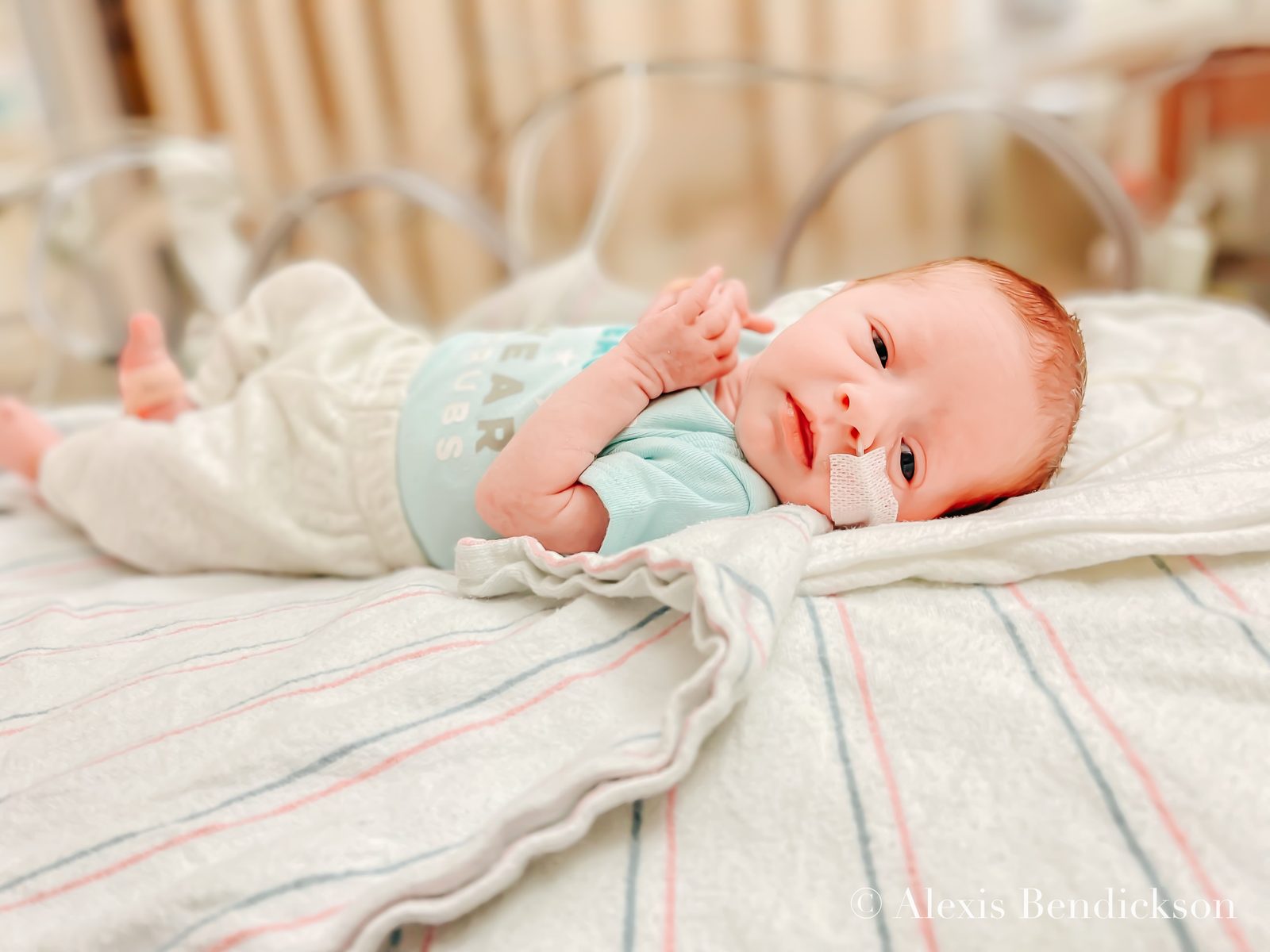 Newborn Emme resting in the NICU, February 2022