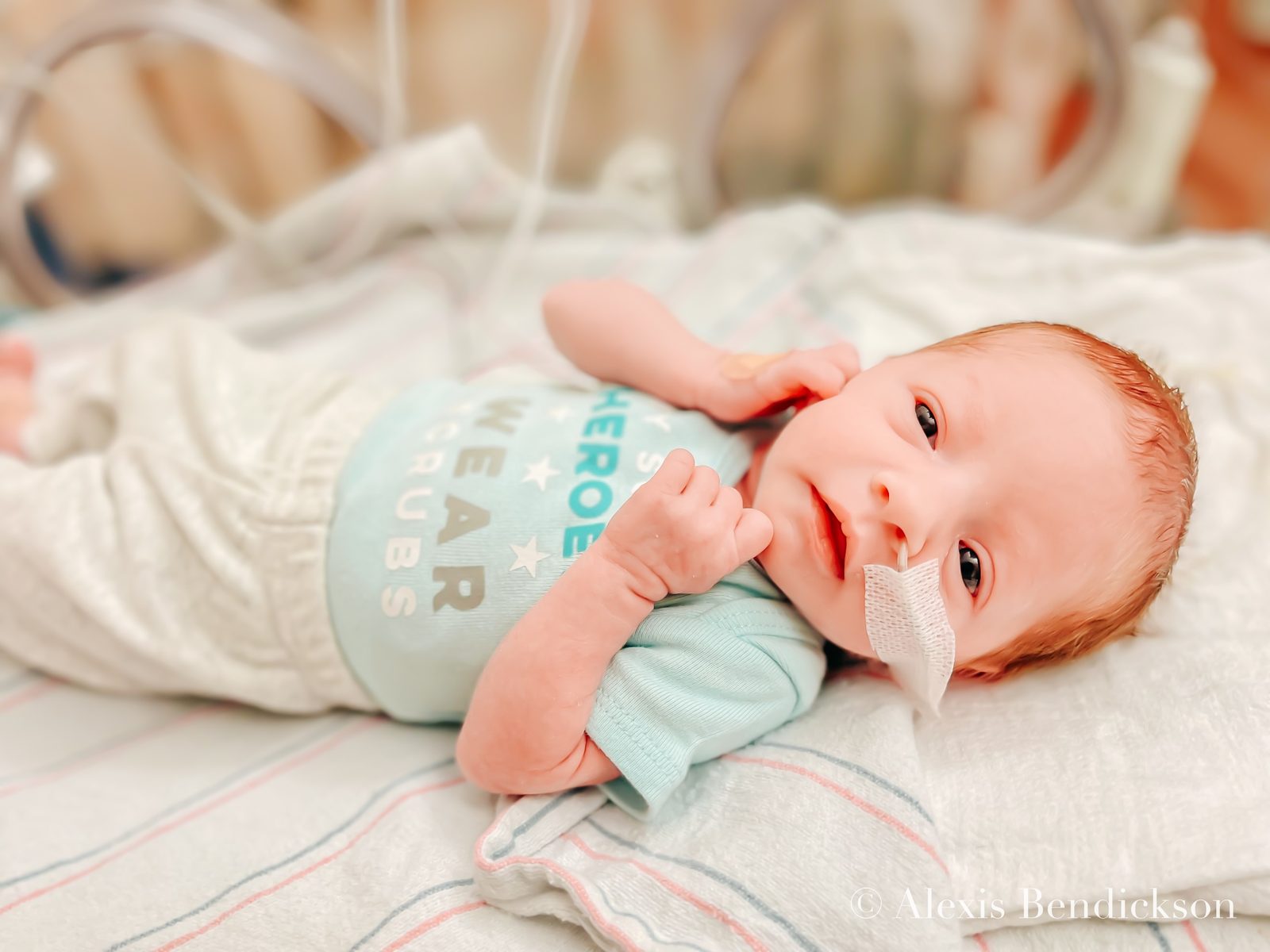 Newborn Emme in the NICU, close portrait, February 2022