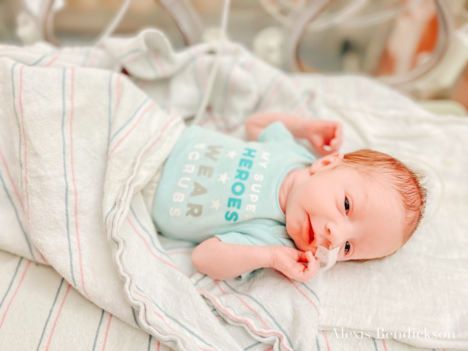 Emme awake and smiling in the NICU, February 2022
